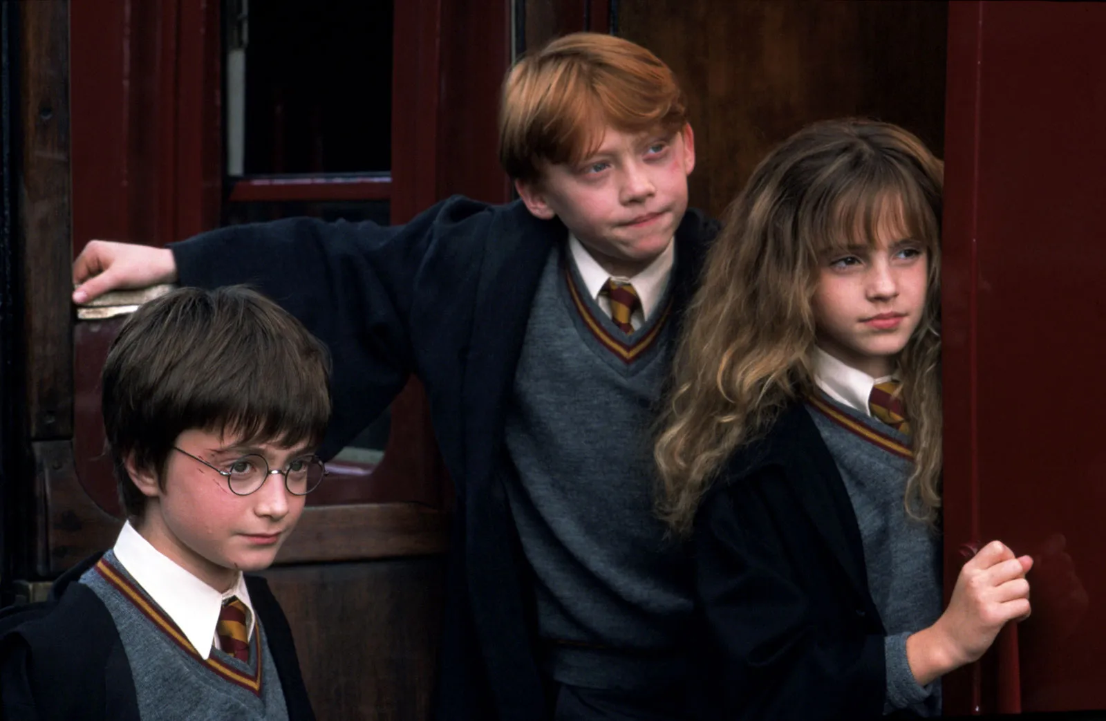 Harry Potter and the Sorcerer's Stone (From left) Daniel Radcliffe, Rupert Grint, and Emma Watson in Harry Potter and the Sorcerer's Stone (2001).